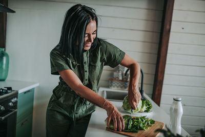 Midsection of man preparing food at home