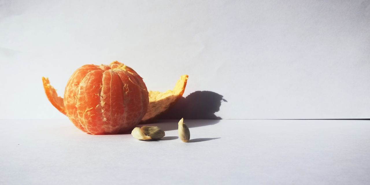 CLOSE-UP OF PUMPKIN ON TABLE