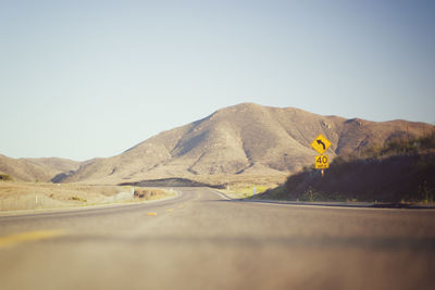 Scenic view of desert against clear sky