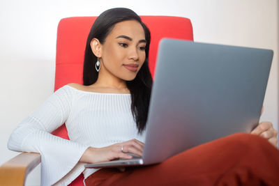 Young woman using mobile phone