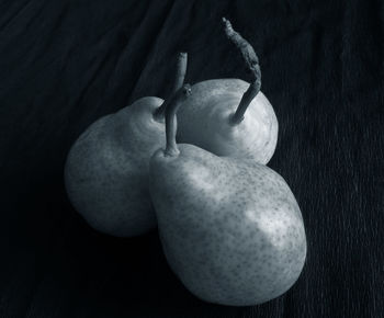 Close-up of apple on table against black background