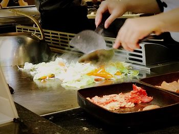 Close-up of man preparing food