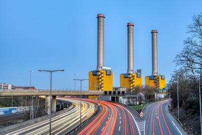 Power station and highway at twilight seen in berlin, germany
