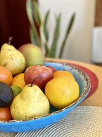 Close-up of fruits in bowl on table