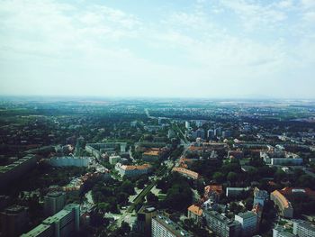 Aerial view of cityscape against sky