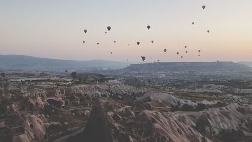 Aerial view of hot air balloons flying in sky