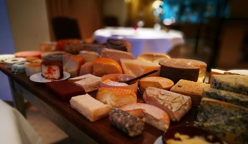 High angle view of various cheeses on table