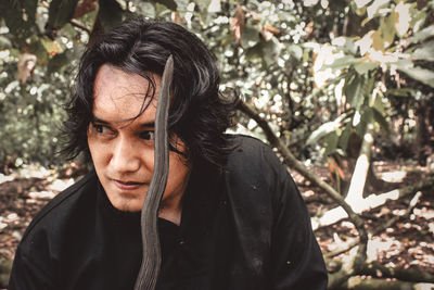 Portrait of young man wearing keris