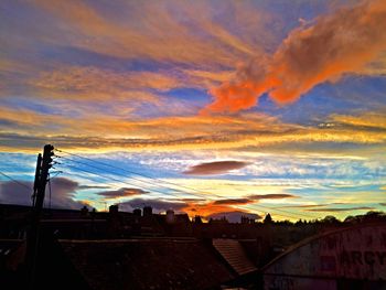 Low angle view of dramatic sky during sunset