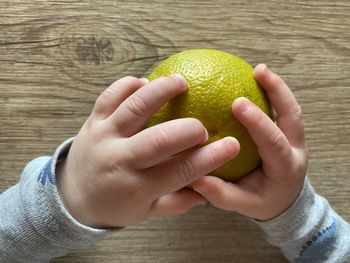 Close-up of hand holding fruit