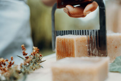 Making handmade natural soaps on an old wooden table