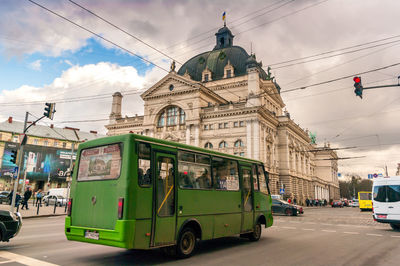 Panoramic view of city street against sky
