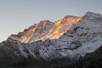 Scenic view of rocky mountains against clear sky