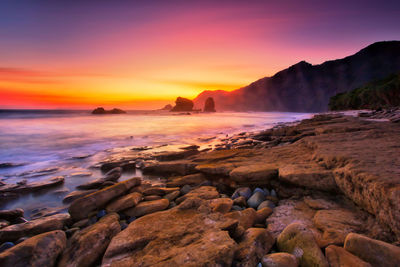 Scenic view of sea against sky during sunset