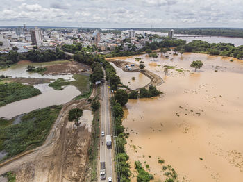 Flooded river with mud after construction of dam