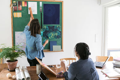 Female colleagues working together in home office