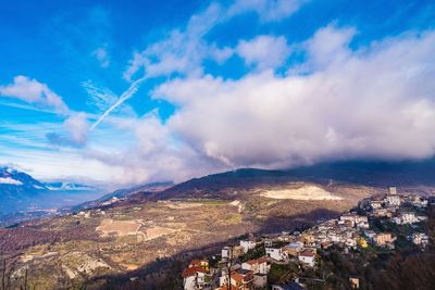 Aerial view of townscape against sky