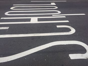 Full frame shot of road with school text