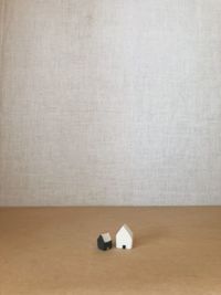 Close-up of paper on table against white background