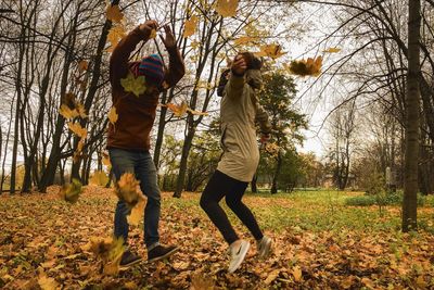 Low section of people on field during autumn