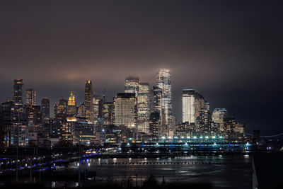 Illuminated buildings in city at night