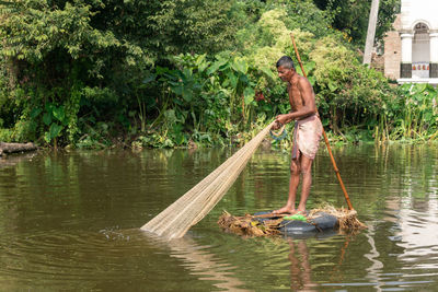 Man standing in lake