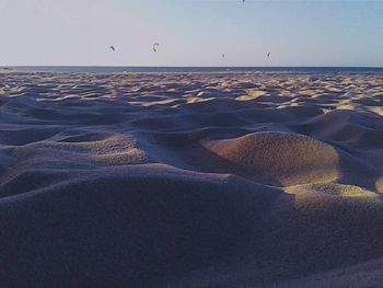 Scenic view of beach against clear sky