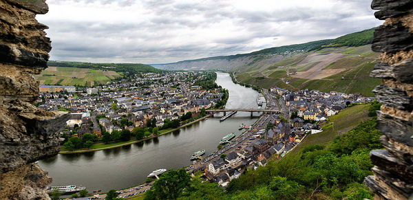 Aerial view of river passing through city