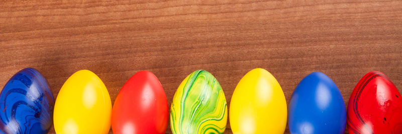 Close-up of multi colored eggs on table