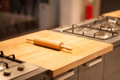 High angle view of rolling pin on kitchen counter at home