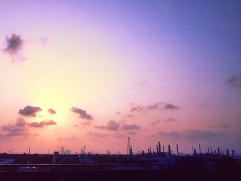 City against sky during sunset