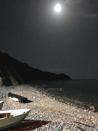 Scenic view of sea against sky at night