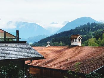 House and buildings against sky