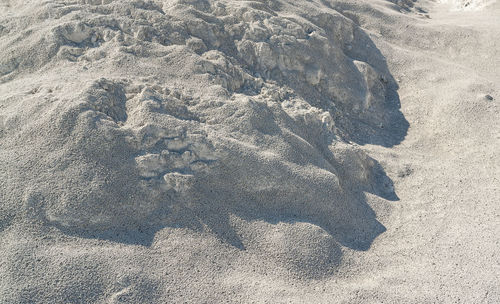 High angle view of sand on beach during sunny day
