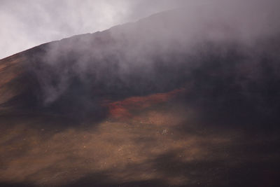 Scenic view of volcanic mountain against sky