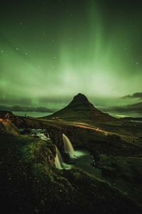 Scenic view of landscape against sky at night