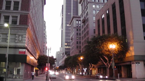 Illuminated city against sky at night