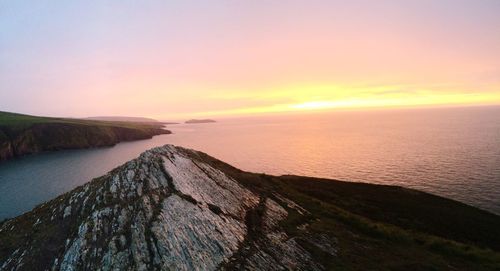 Scenic view of sea at sunset