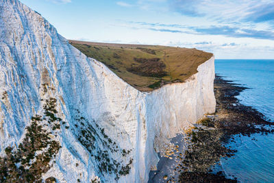 Aerial view of the white cliffs of dover. close up view of the cliffs from the sea side.