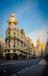 View of buildings against blue sky