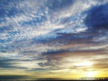 Low angle view of dramatic sky during sunset