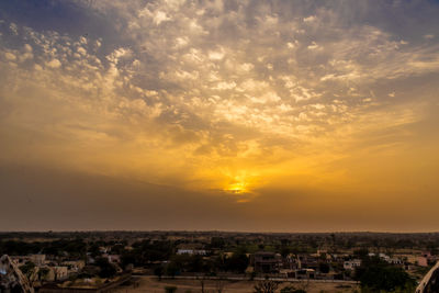 High angle view of townscape against sky at sunset