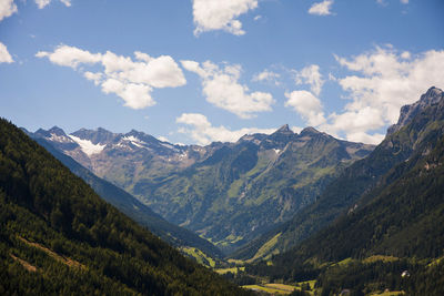 Scenic view of mountains against cloudy sky