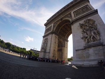 Low angle view of monument against sky in city