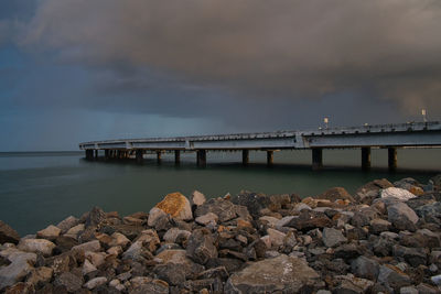 Bridge over sea against sky