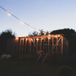 Fence against clear sky at dusk