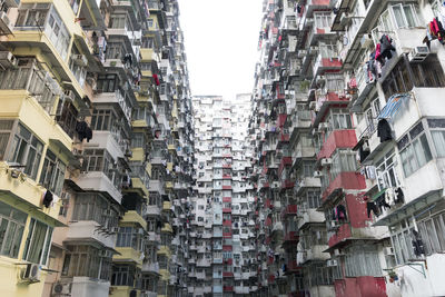 Low angle view of buildings in city against sky