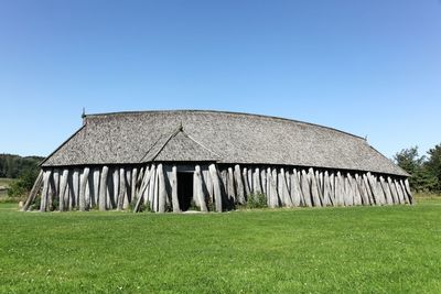 Built structure on field against clear sky