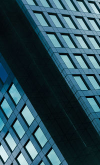Low angle view of modern building against sky in city