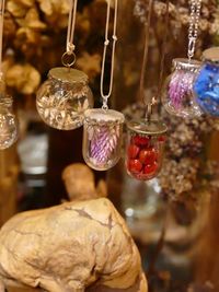 Close-up of illuminated decorations hanging from for sale
